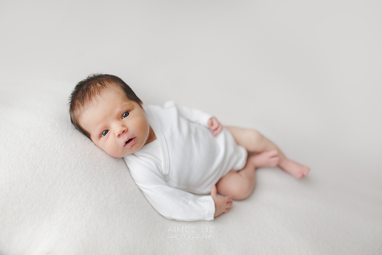 white onesie newborn photographer