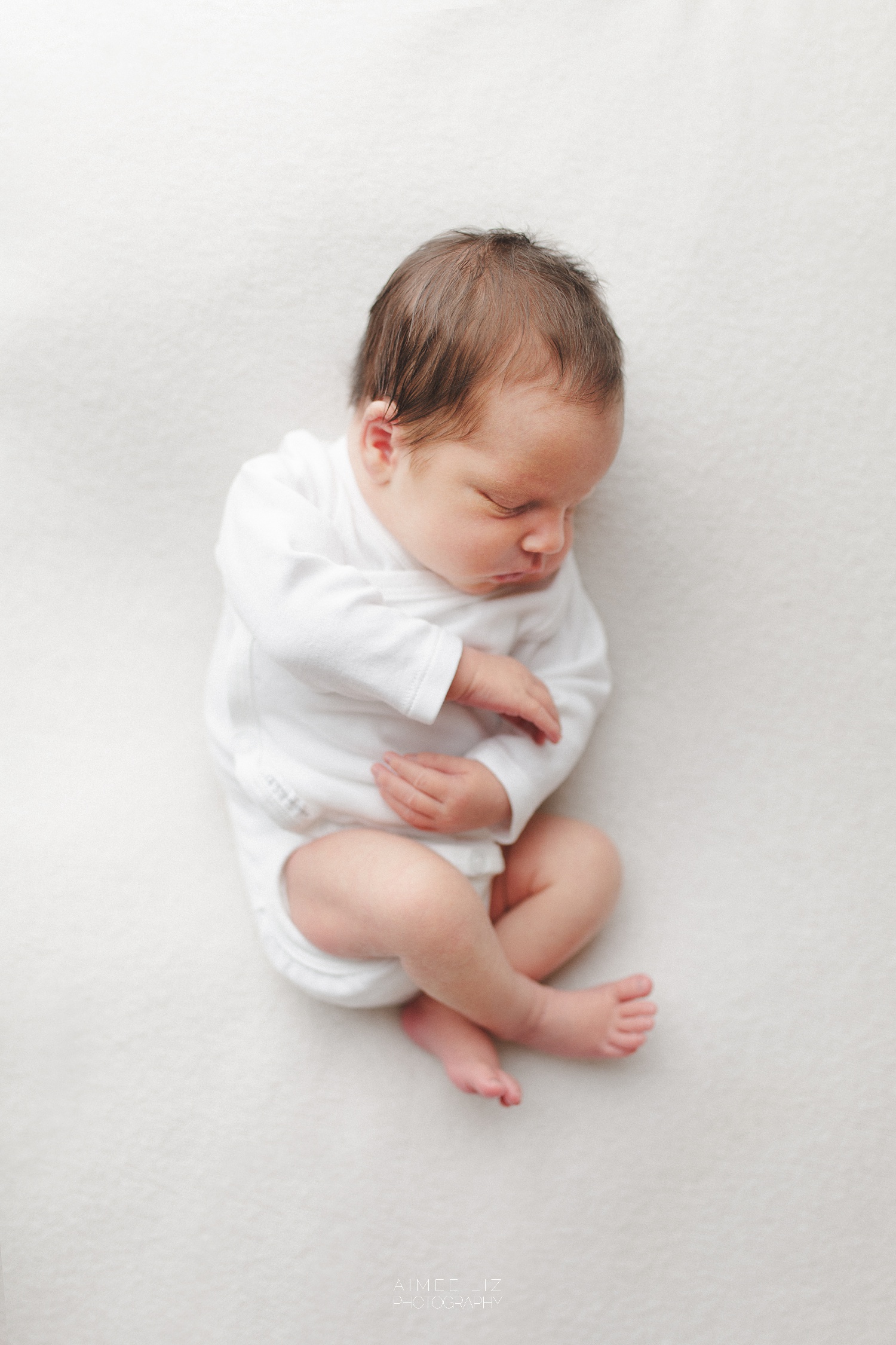 white onesie newborn photographer