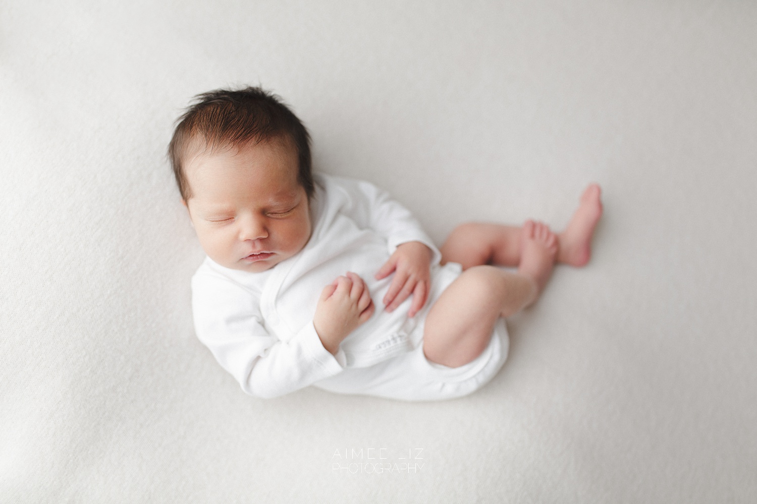 white onesie newborn photographer