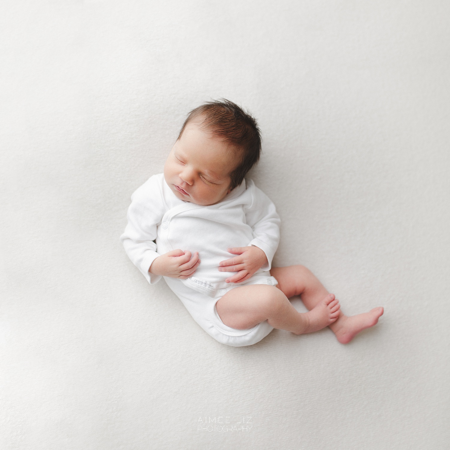 white onesie newborn photographer