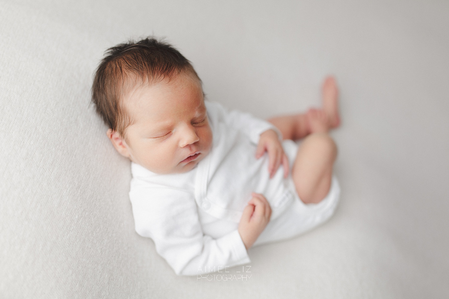 white onesie newborn photographer