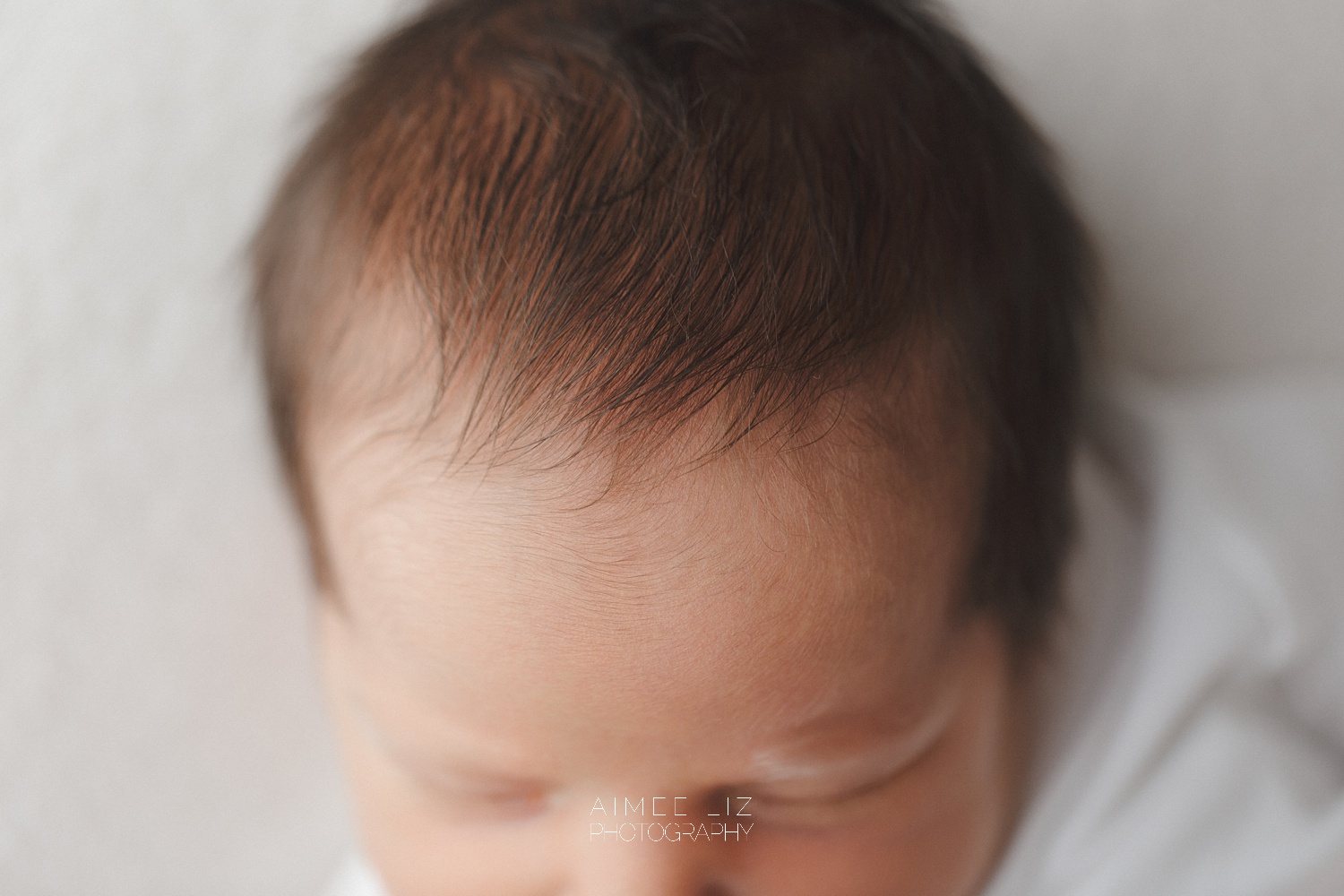 white onesie newborn photographer