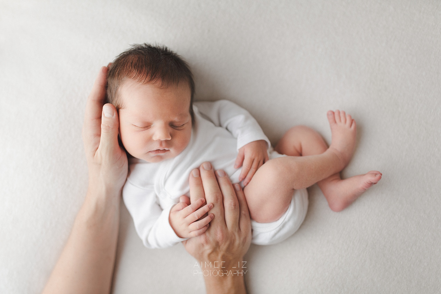 white onesie newborn photographer