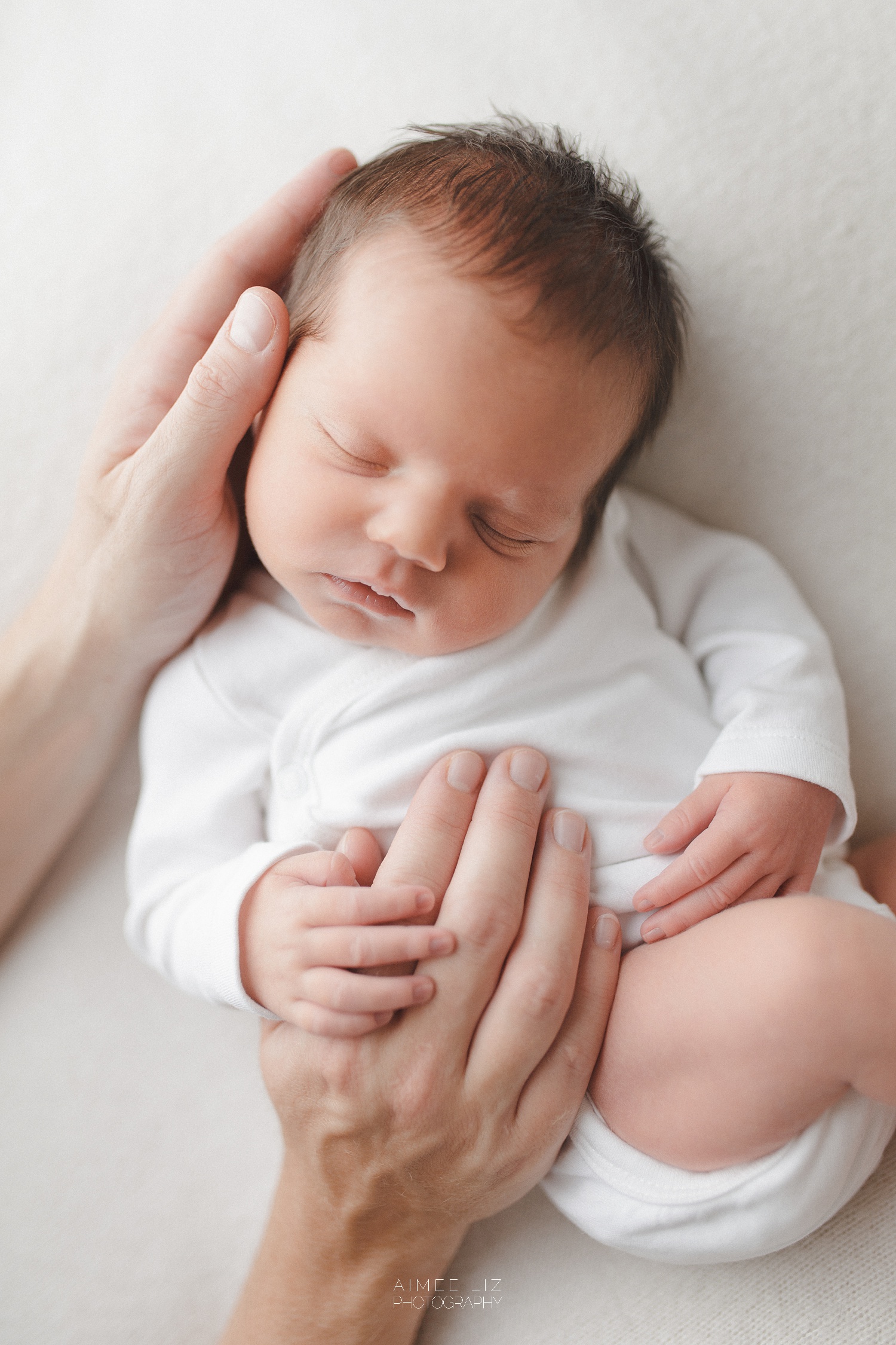 white onesie newborn photographer