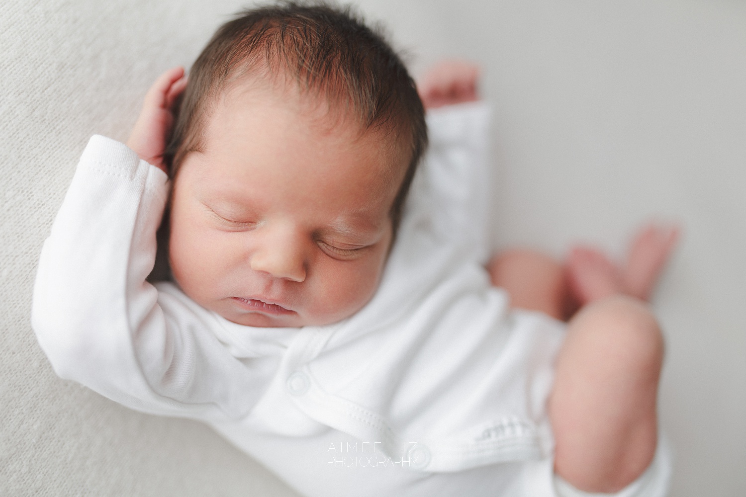 white onesie newborn photographer