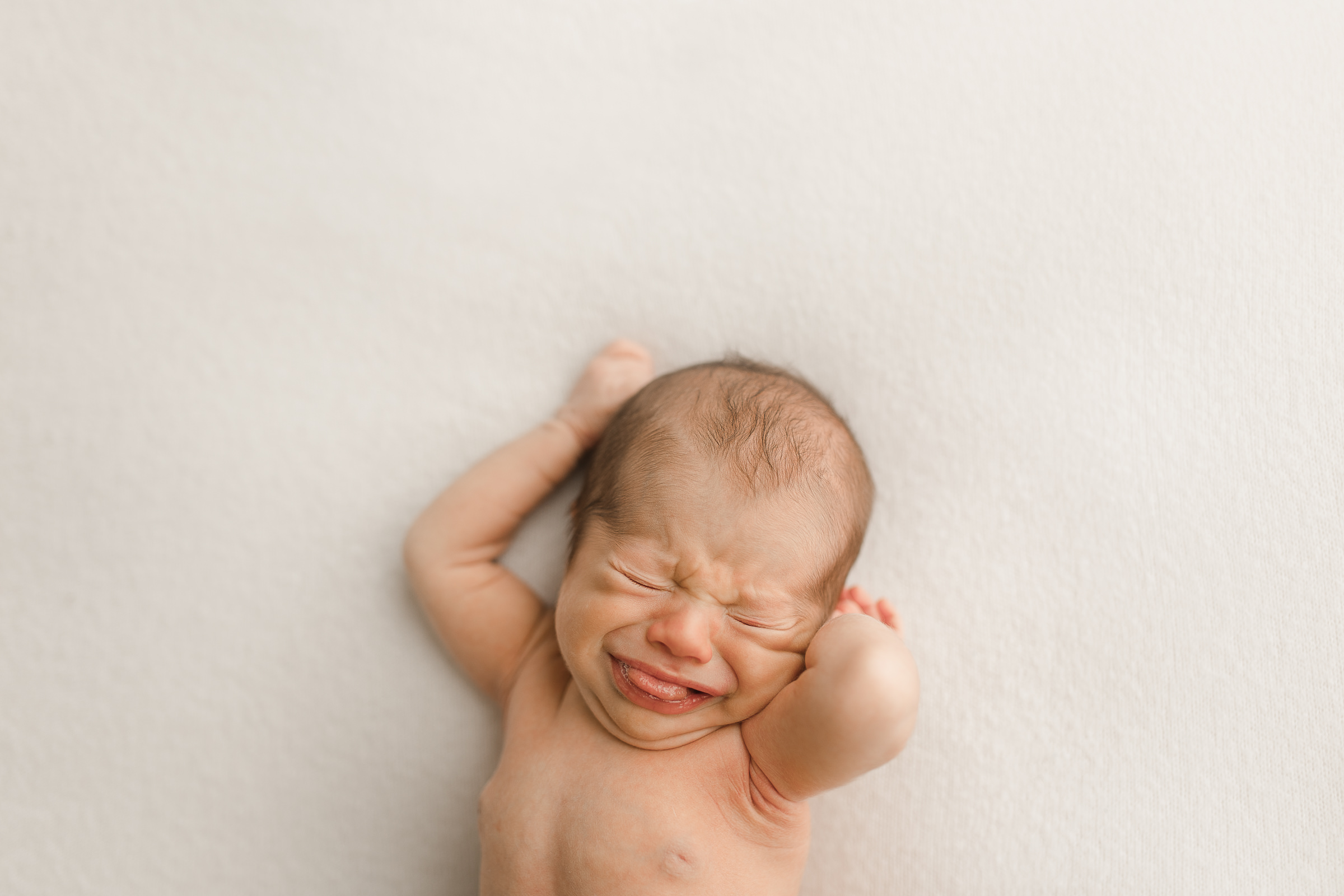 candid newborn photographer