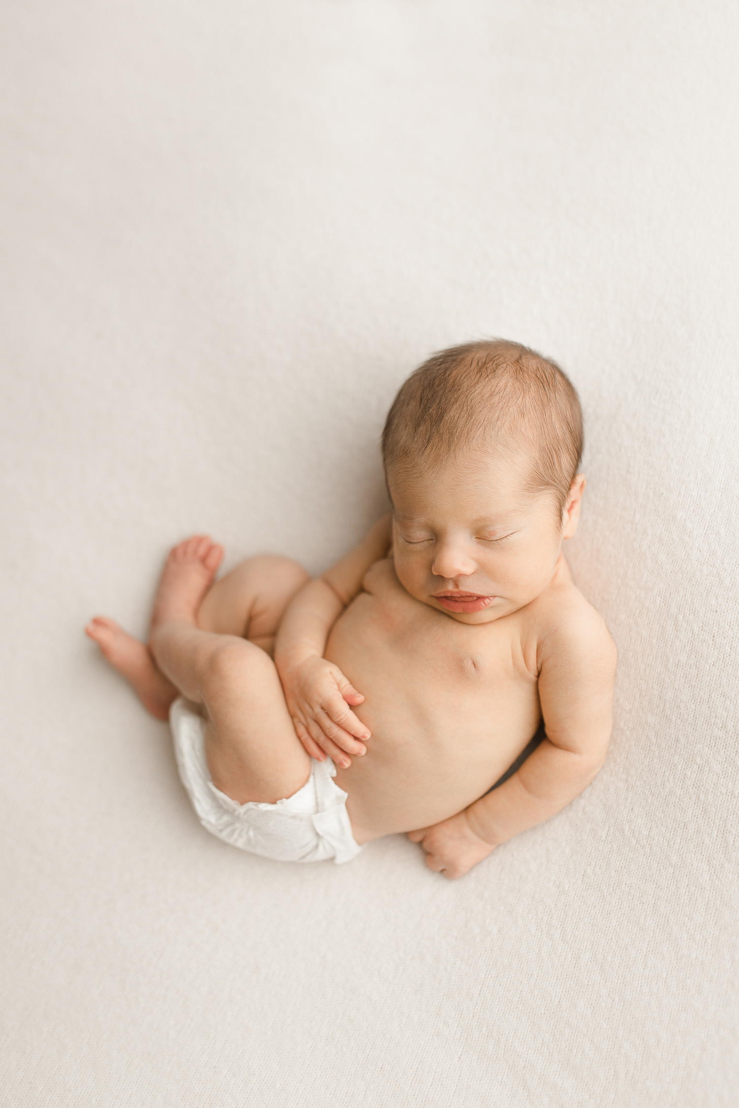 newborn photography on white